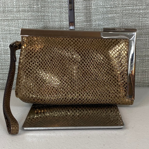Calvin Klein Handbags - Calvin Klein Gold Clutch Wristlet